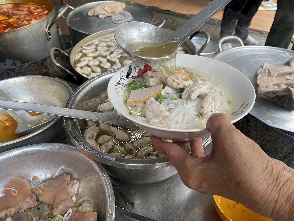A comforting bun moc suon sun with tender pork balls and crunchy cartilage ribs in a savory broth